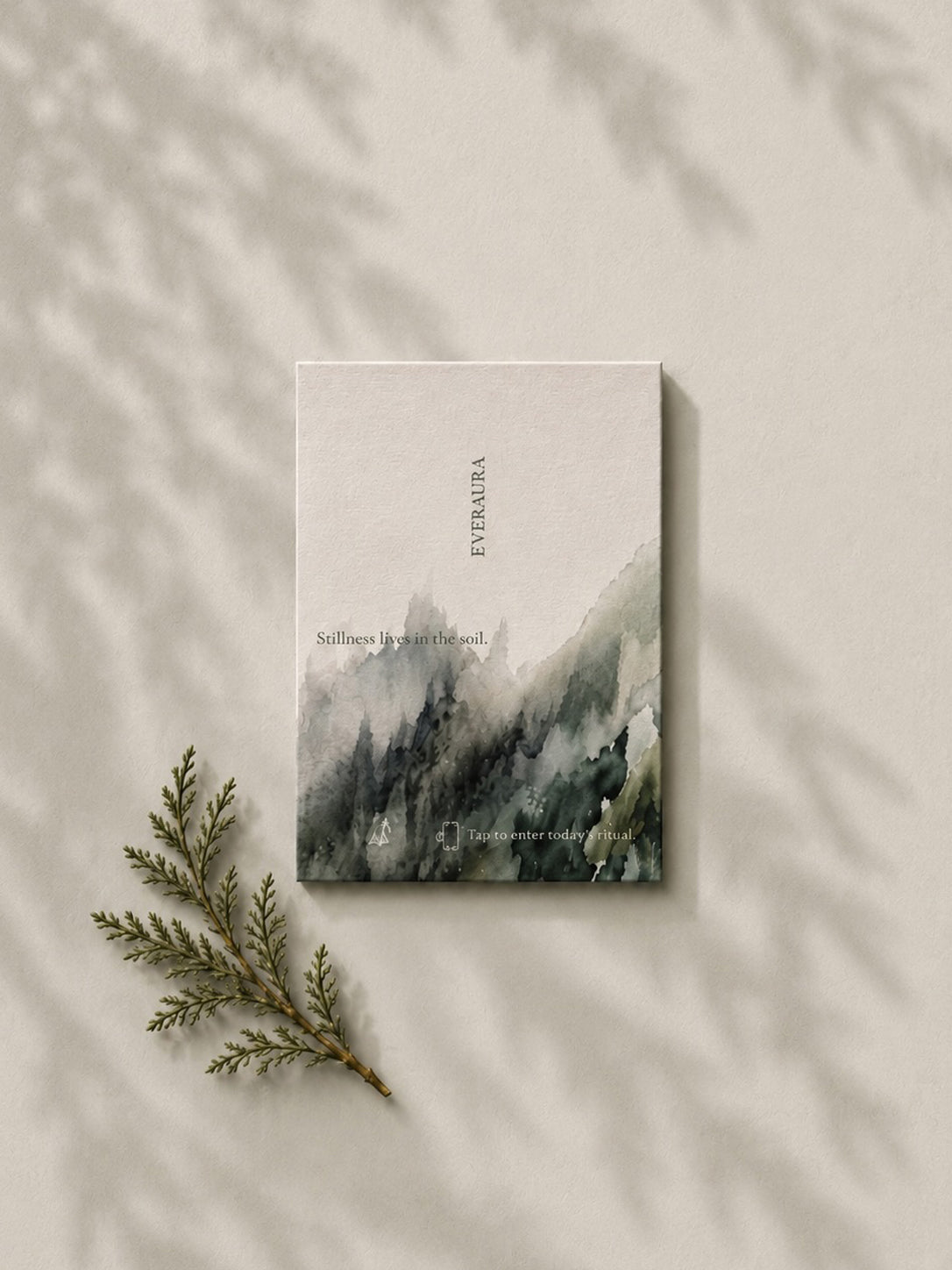 EverAura Grounding ritual card, Stillness lives in the soil, a soft watercolor forest design with a cedar sprig. A grounding nature meditation scent card.
