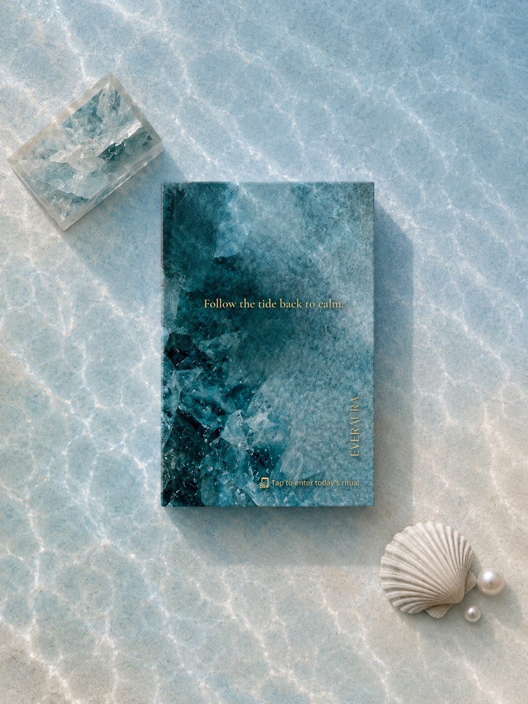 EverAura Ocean Healing ritual card, Follow the tide back to calm, styled on pale marble under rippling water with a crystal, a shell and pearls. A one minute nature meditation and scent card.